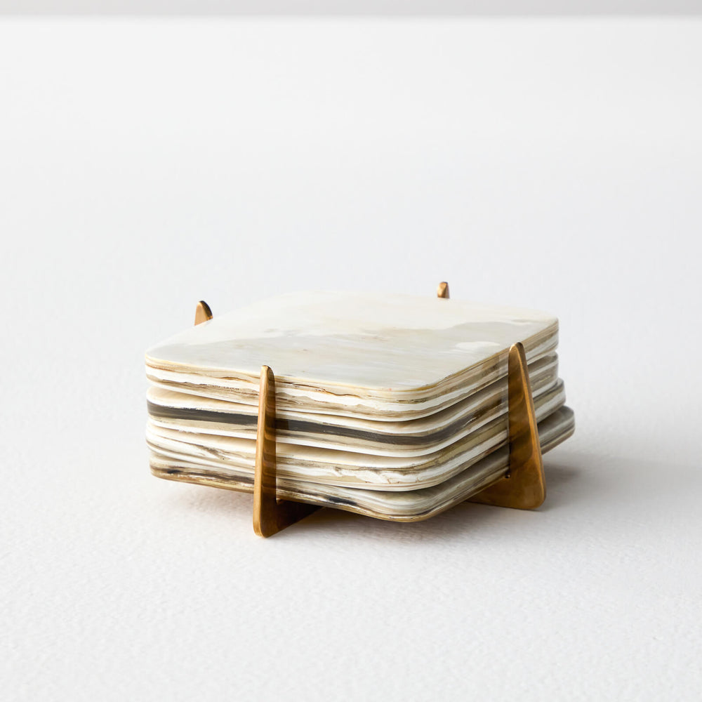 Zuri coaster set by Fairkind made with recycled horn and pure brass.