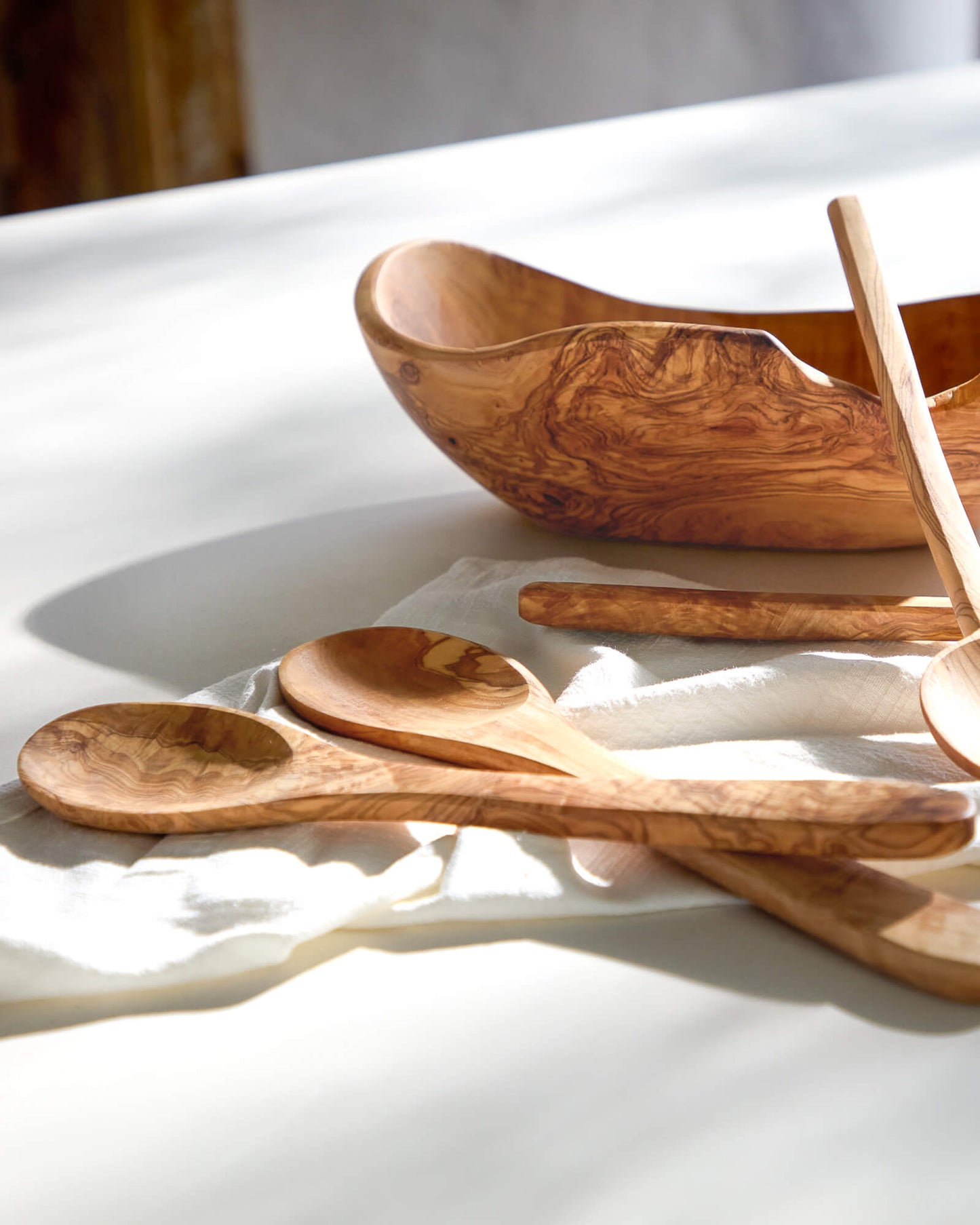 
                  
                    Premium olive wood serving spoons by Fairkind.
                  
                