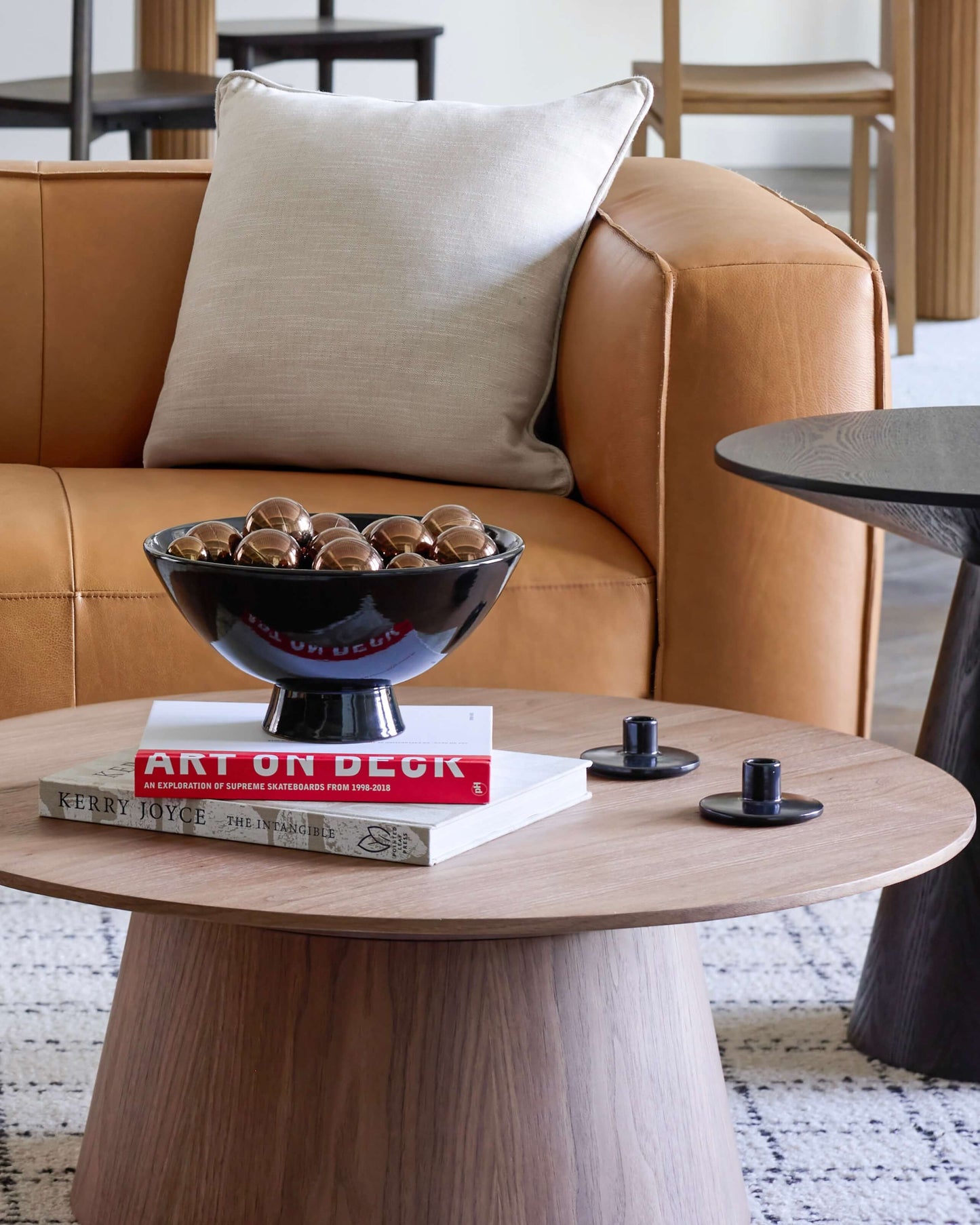 
                  
                    Holiday styled living room with black ceramic pedestal bowl on round coffee table. Modern handmade ceramics from Morocco.
                  
                