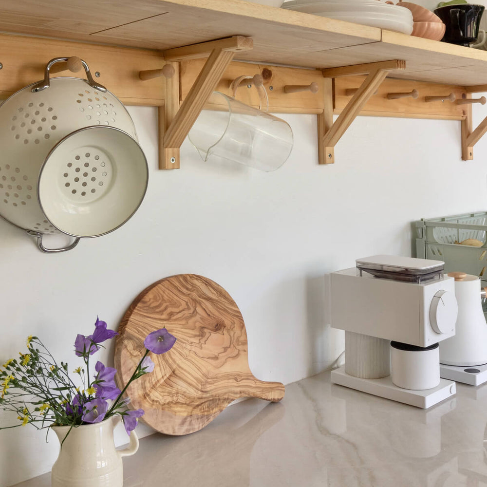 
                  
                    Neutral kitchen countertop with Fairkind's Chebika Bread Board on display. Photo via @chloe.rey
                  
                