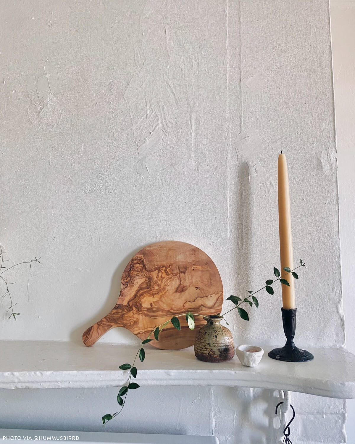 
                  
                    Marbled olive wood board set on mantle as statement decor. Photo via @hummusbirrd
                  
                