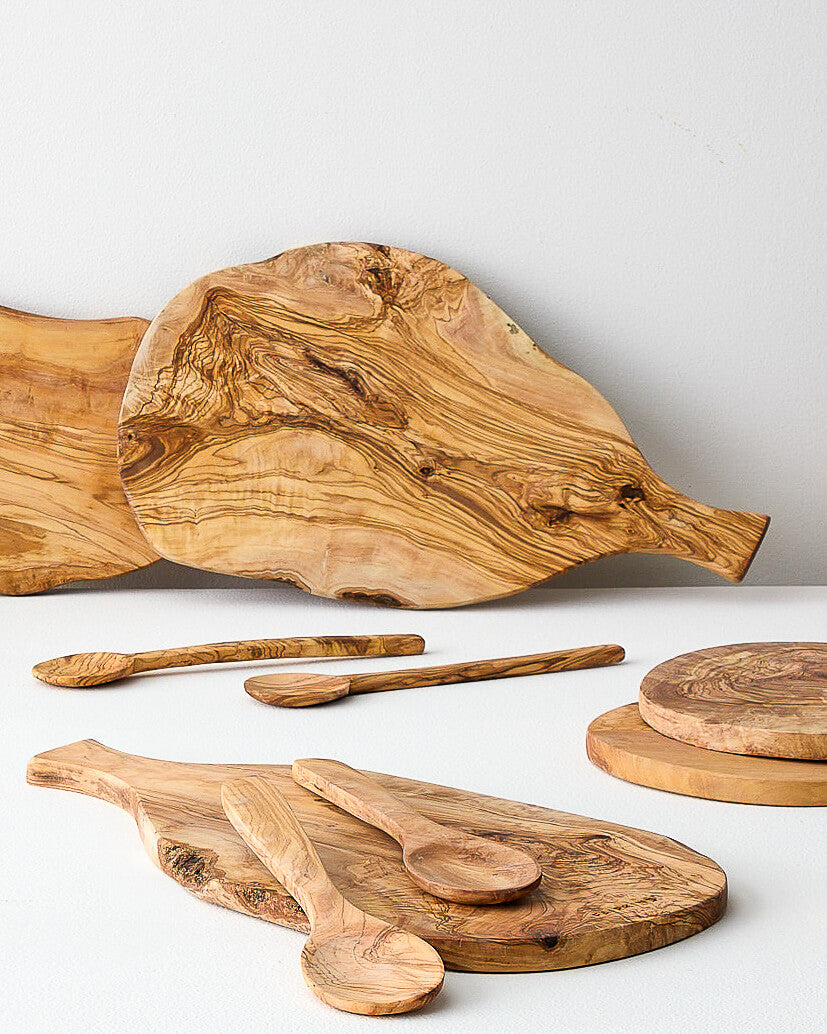 
                  
                    Collection of olive wood charcuterie boards handmade in Tunisia.
                  
                