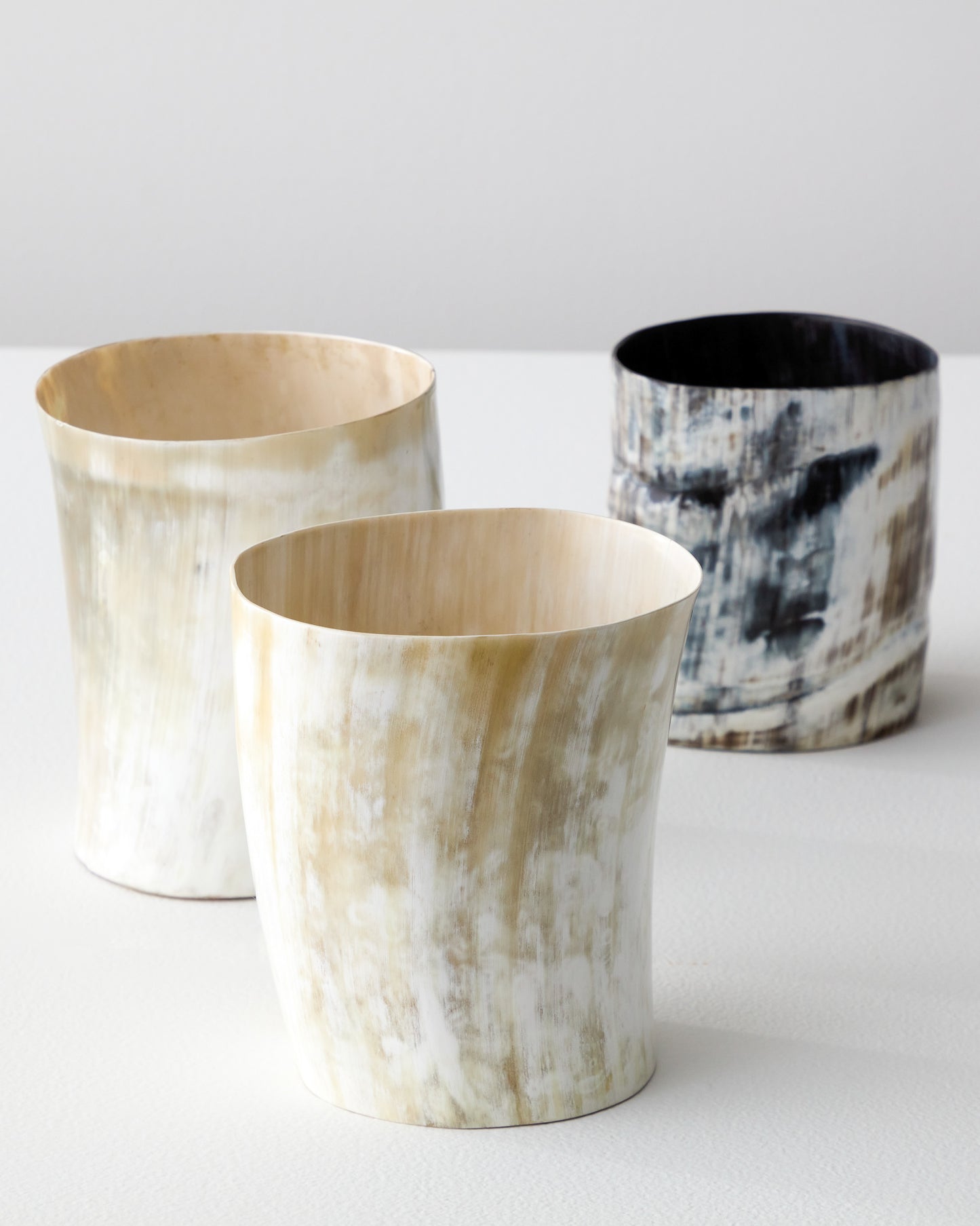 
                  
                    Light and dark Kibwe utensil holders each one of a kind made with ethically sourced Ankole horn.
                  
                