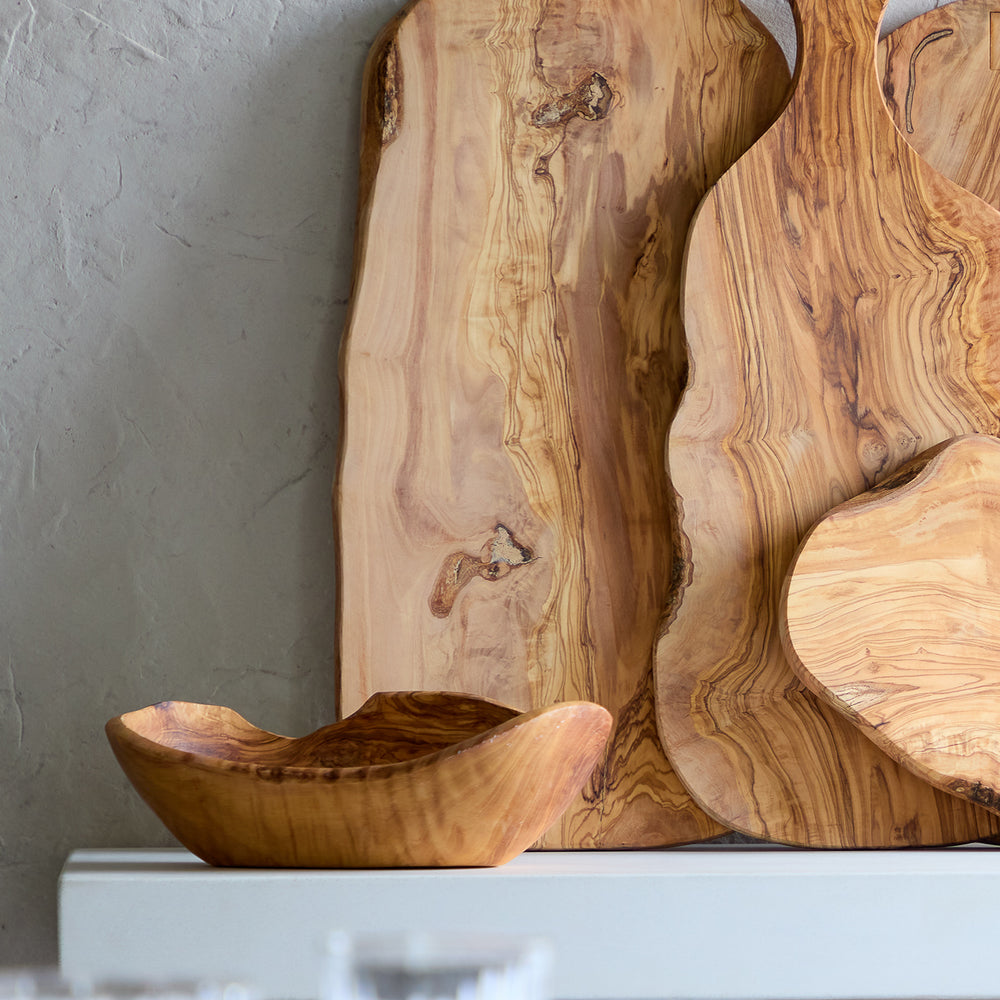 
                  
                    Large olive wood charcuterie boards styled on sideboard.
                  
                