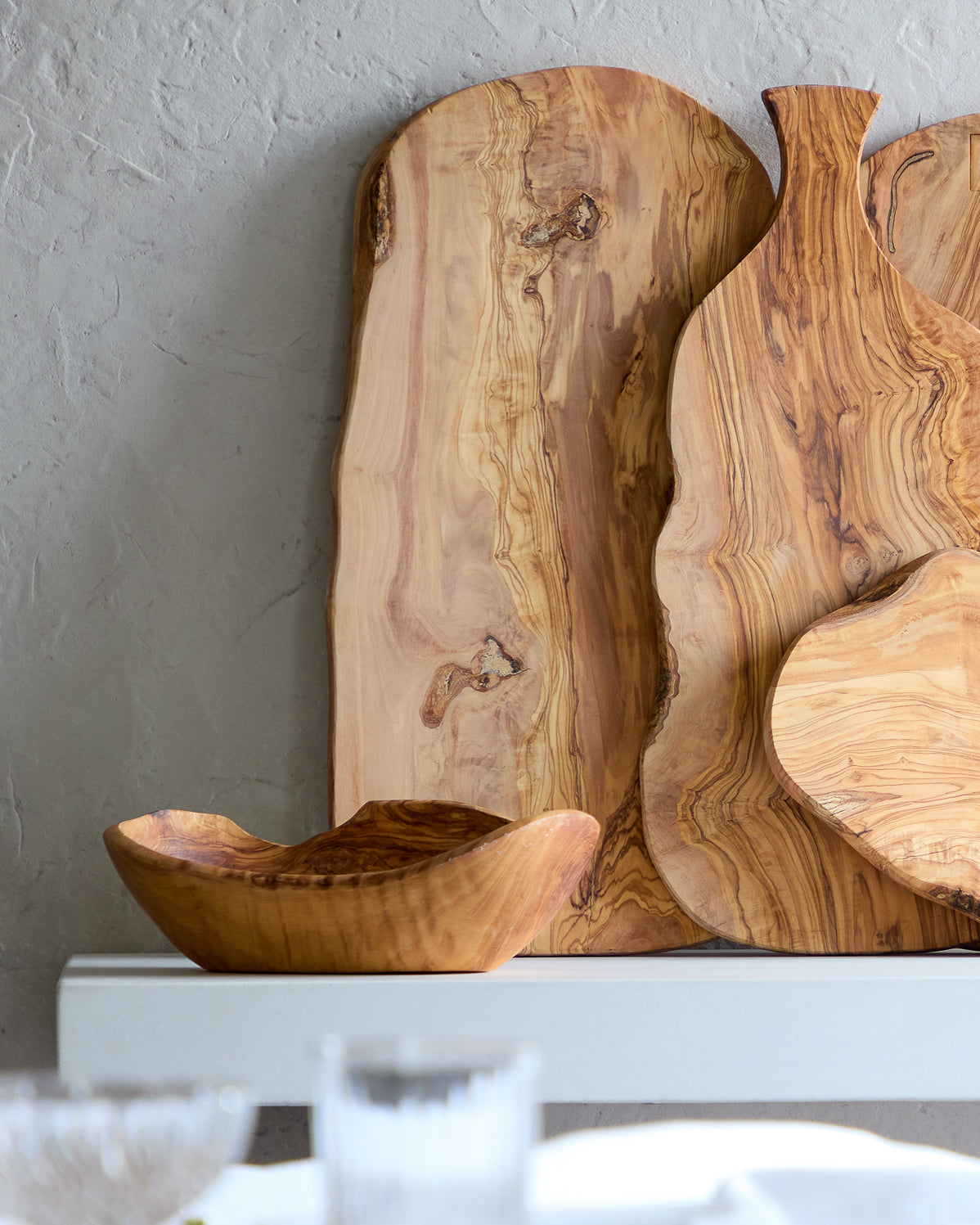 
                  
                    Large olive wood charcuterie boards styled on sideboard.
                  
                