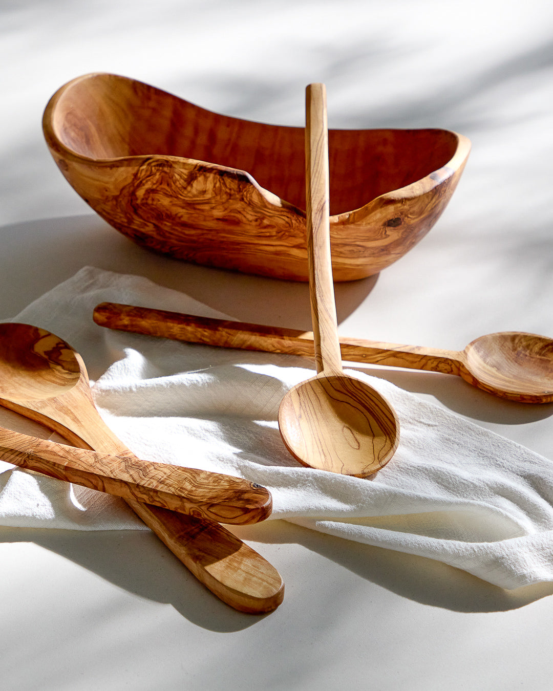 
                  
                    Olive wood serving ware with linen napkin. Premium serving bowl and spoons made by hand.
                  
                