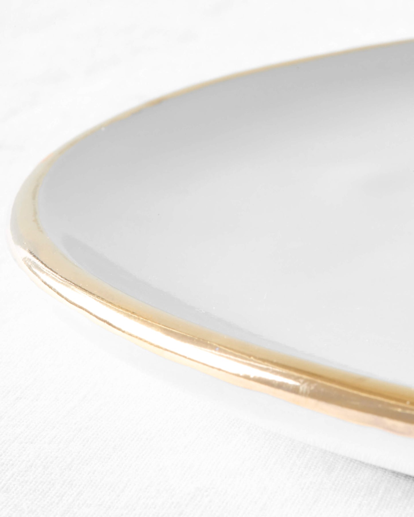 
                  
                    Close-up of Fez Gold-Rimmed dinner plate, handmade in Morocco.
                  
                