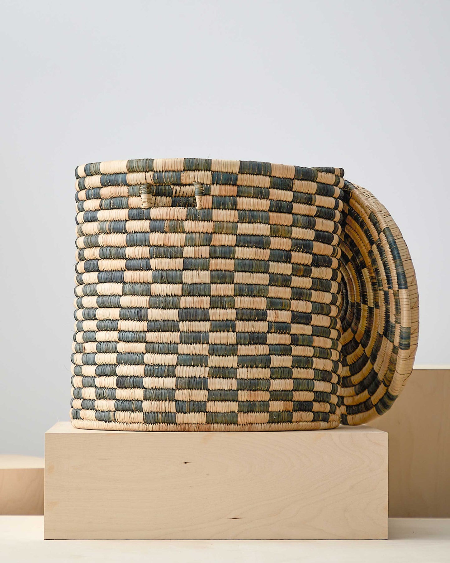 
                  
                    Large lidded checkered laundry basket. Handmade in Malawi.
                  
                