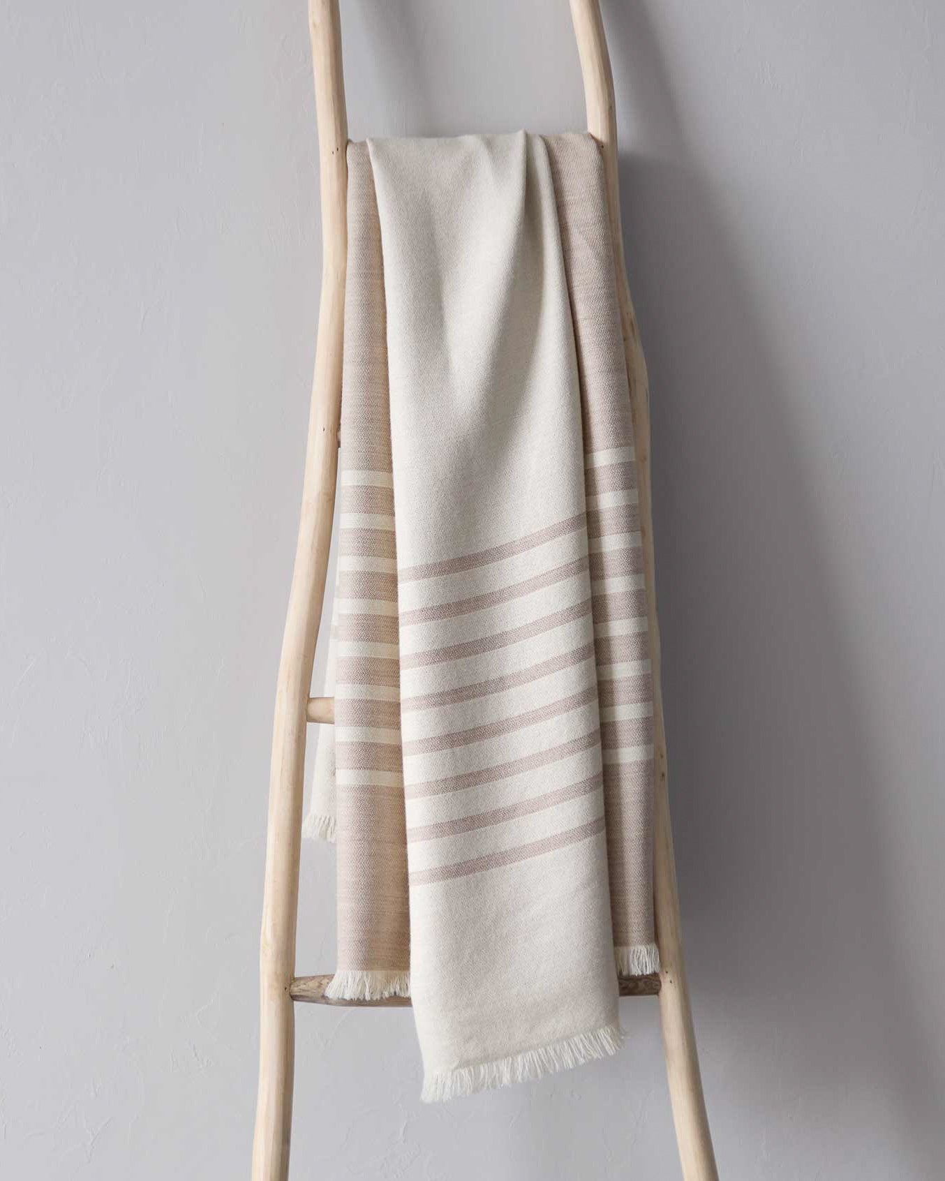 Sand colored luxury baby alpaca throw blanket by Fairkind ethically sourced and fair trade made in Peru.
