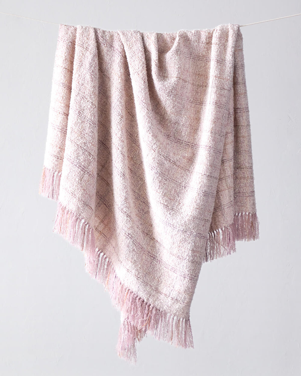 Fairkind Cariño pink alpaca throw blanket handwoven by artisans in Peru.