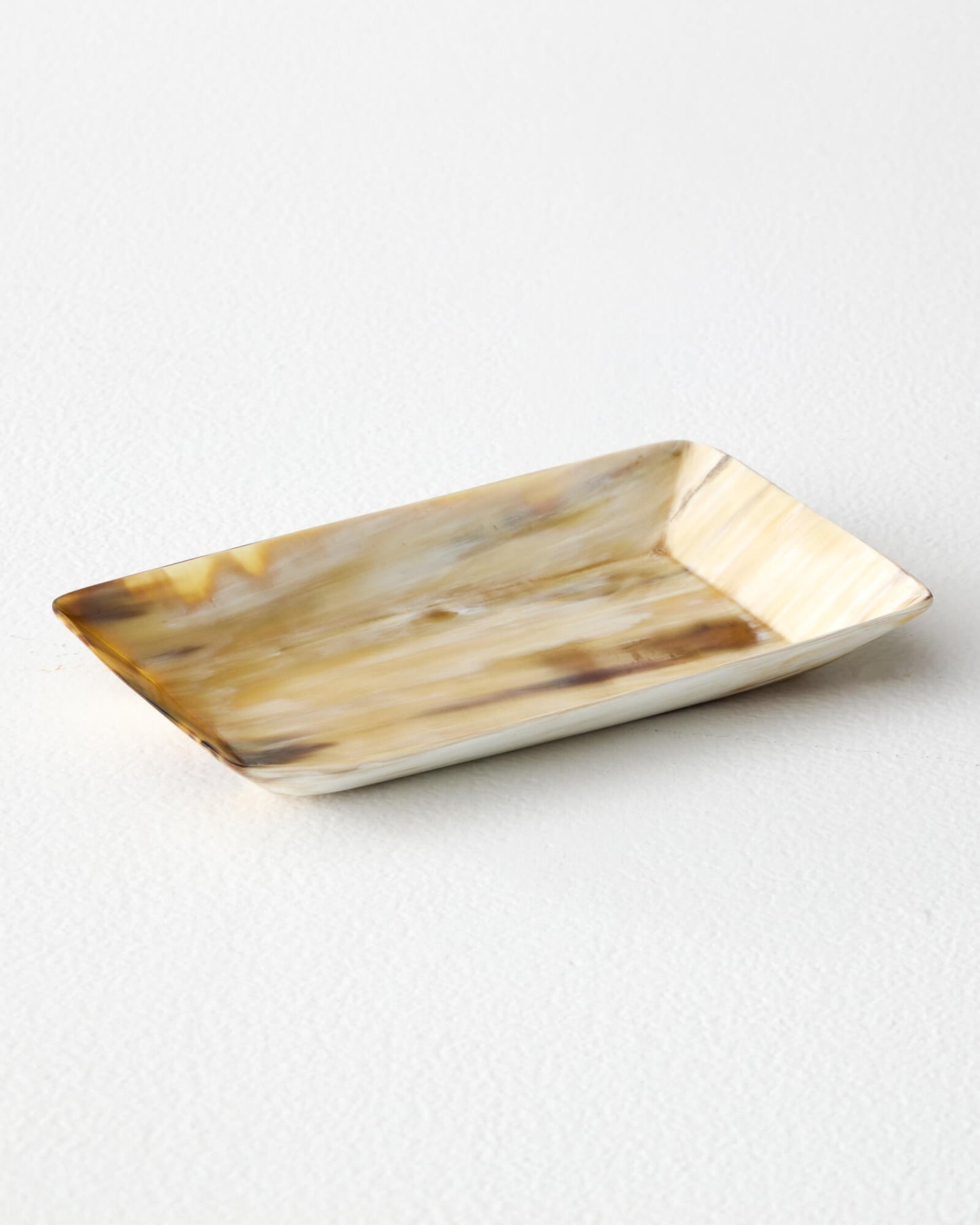 
                  
                    Light Nadira Tray by Fairkind. Handcrafted in Uganda with ethically sourced horn.
                  
                