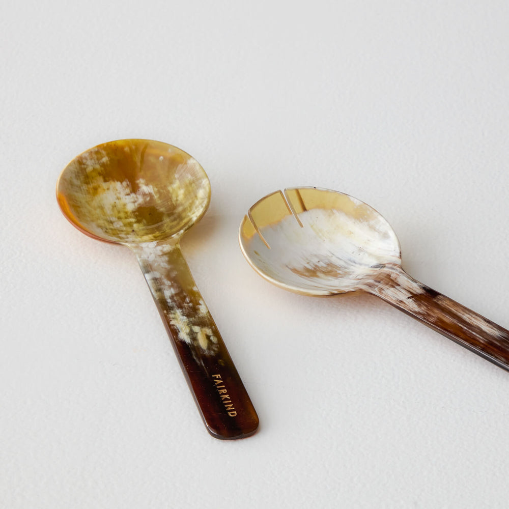 Fairkind white cow horn serving spoons detail with limited edition logo emblem.