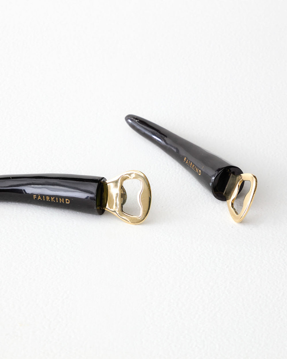 Akina bottle opener black dark with brass opener luxury barware gift handmade and ethically sourced in Uganda.