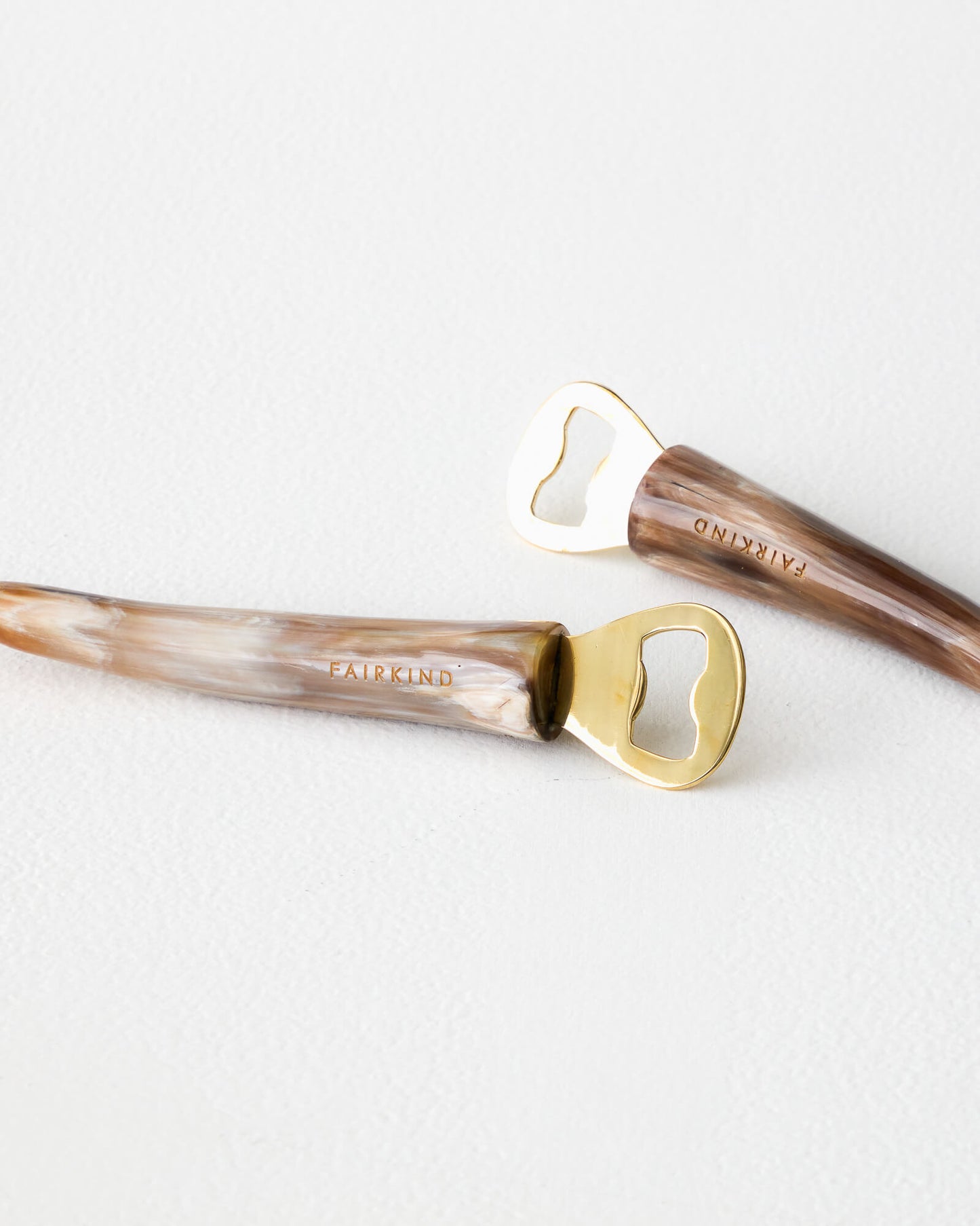 
                  
                    Fairkind Ankole horn bottle opener, collection of ethically sourced and handmade barware.
                  
                