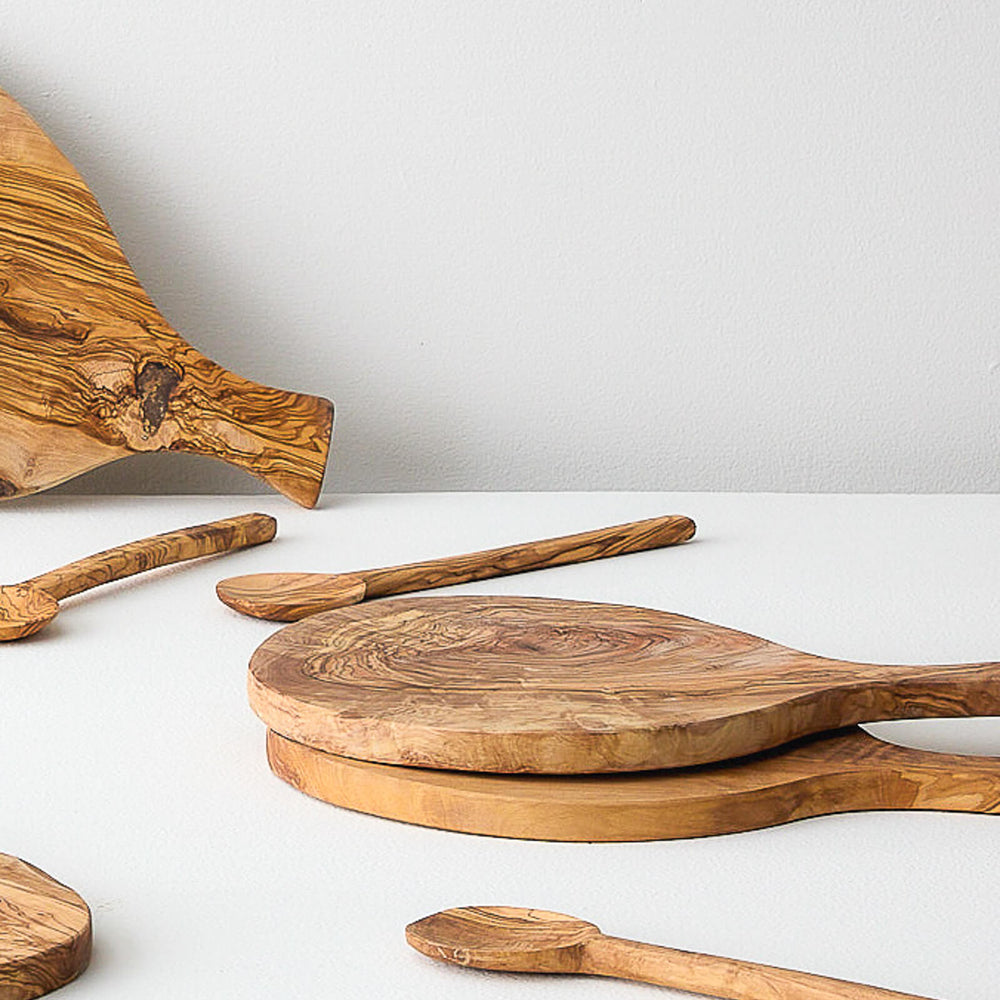 
                  
                    Luxury olive wood serving boards made by master artisans in Tunisia.
                  
                