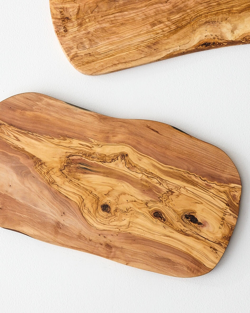 
                  
                    Olive wood serving boards handmade by master artisans in Tunisia.
                  
                