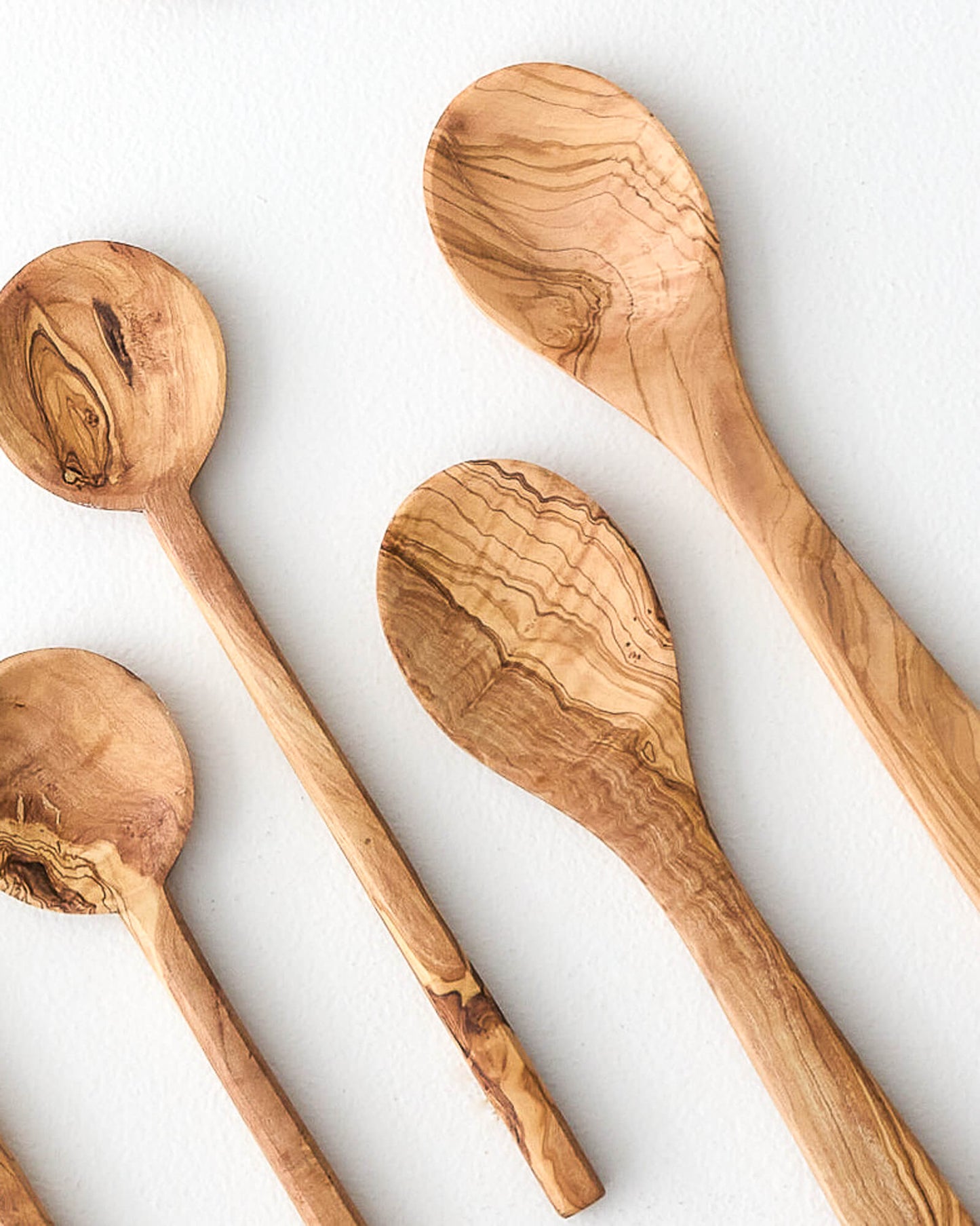 Olive wood cooking spoon sets handcarved by artisans in Tunisia.