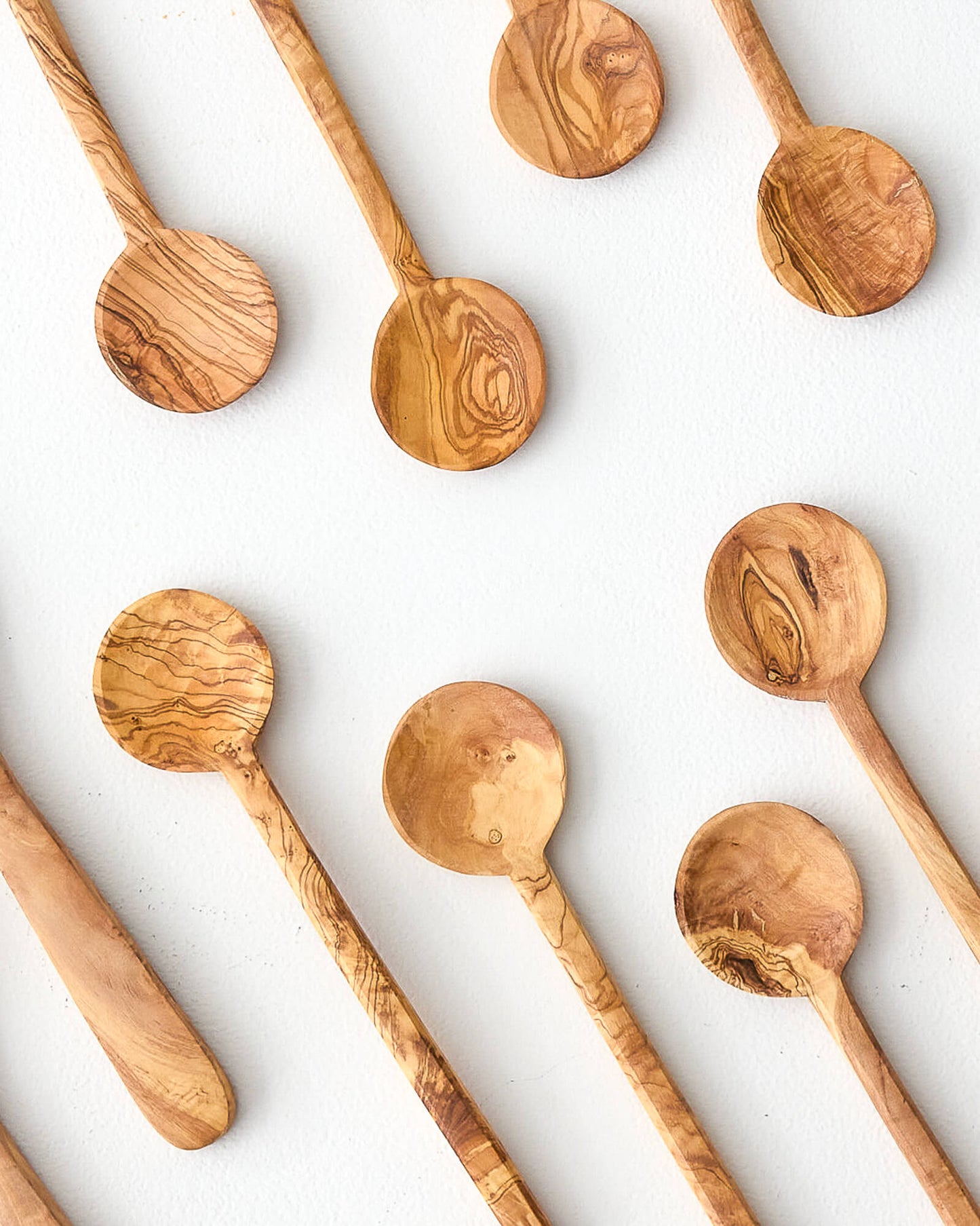 
                  
                    Variety of handcrafted olive wood spoons by Fairkind.
                  
                