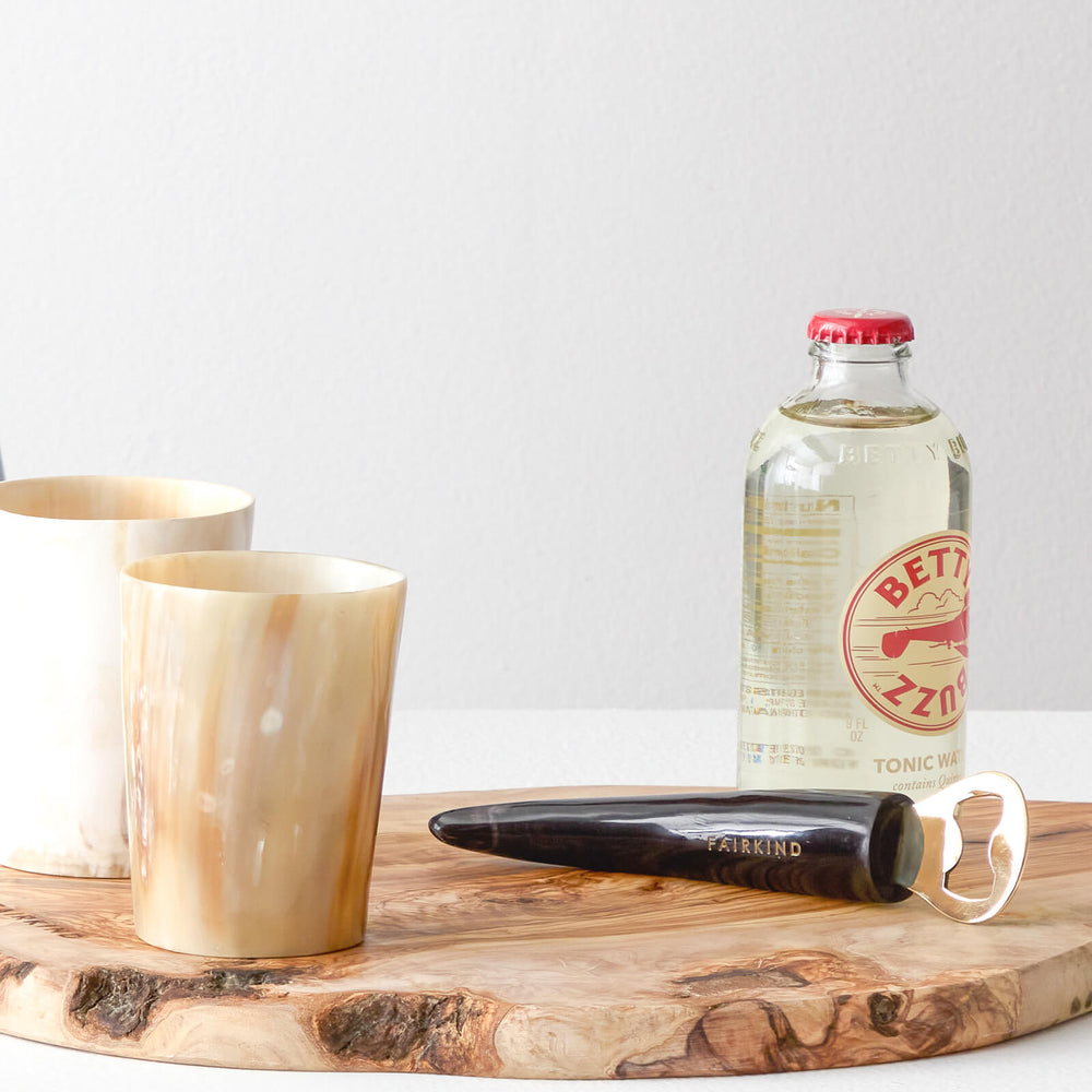 
                  
                    Handcrafted barware bottle opener and tumbler set ethically made Ankole horn and brass.
                  
                