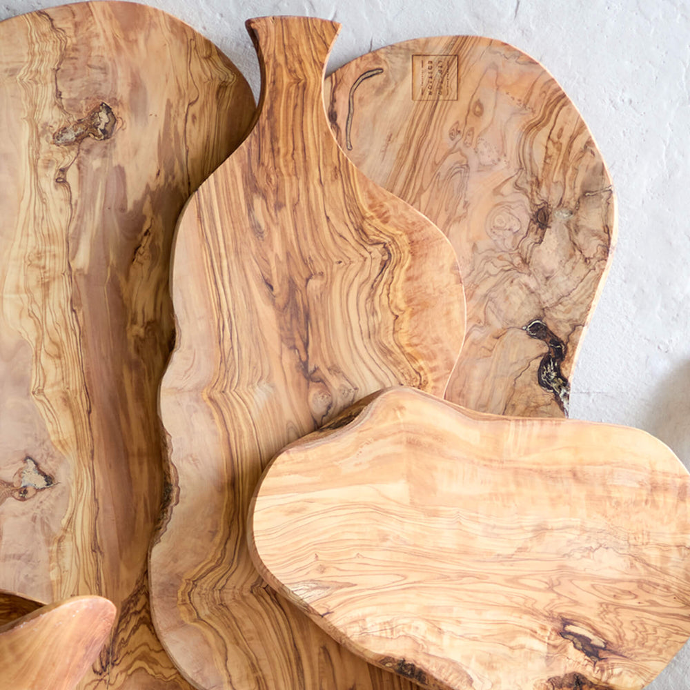 
                  
                    Holiday season sideboard with large olive wood serving boards.
                  
                