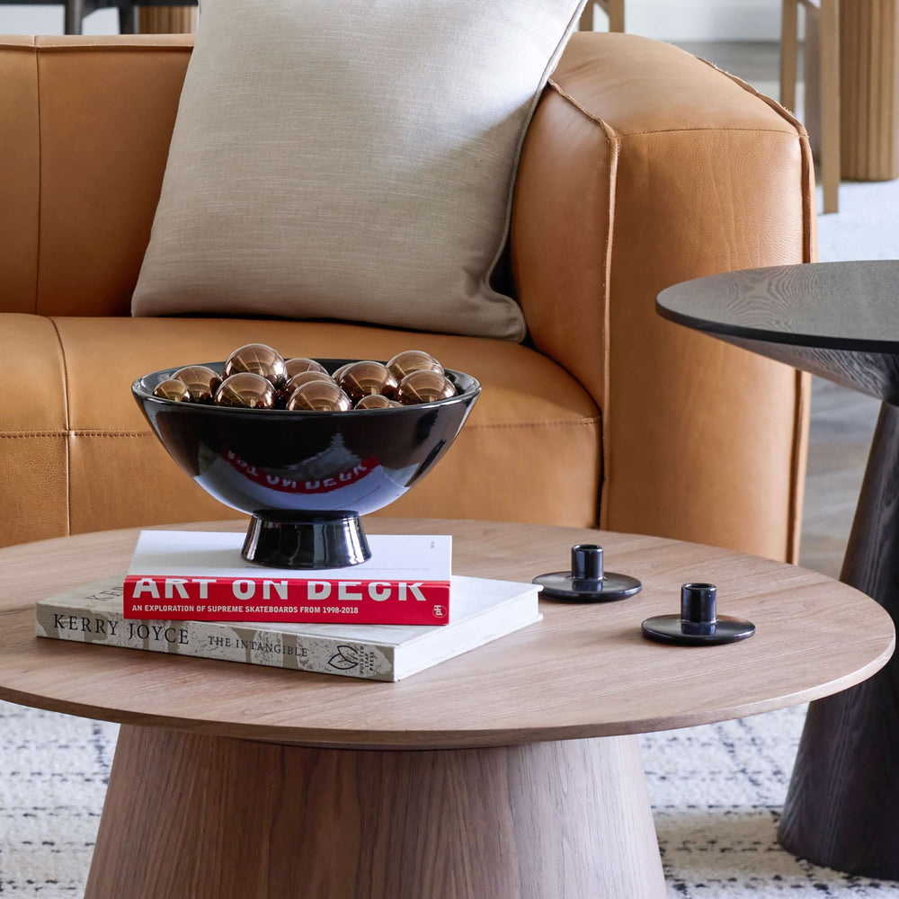 
                  
                    Holiday styled living room with black ceramic pedestal bowl on round coffee table. Modern handmade ceramics from Morocco.
                  
                