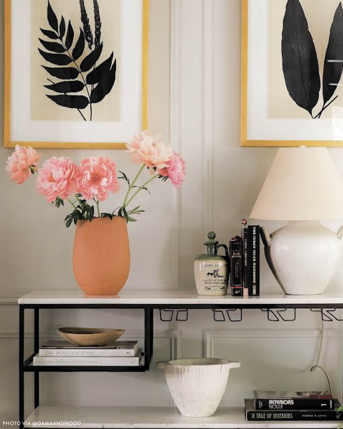 
                  
                    Red terracotta clay vase styled in entryway with pink flowers. Photo via @damaandwood
                  
                