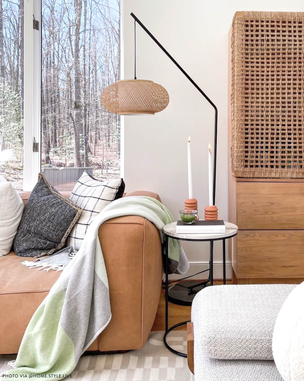 
                  
                    Small and large terracotta candle holders on side table in fresh, modern living room. Photo via @home.style.live
                  
                