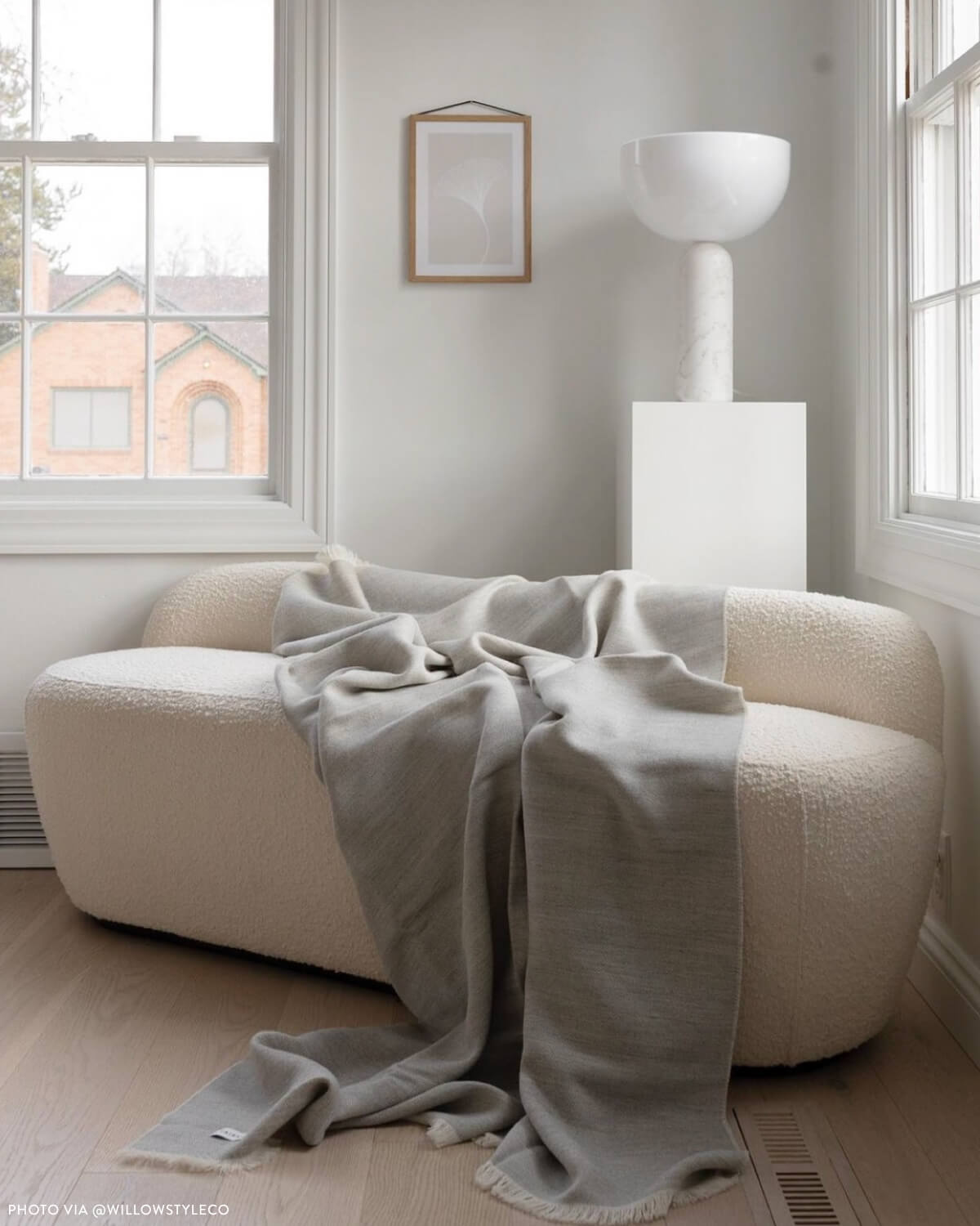 
                  
                    Light gray and white baby alpaca blanket with white fringe neutral tones handwoven in Peru Fairkind.
                  
                