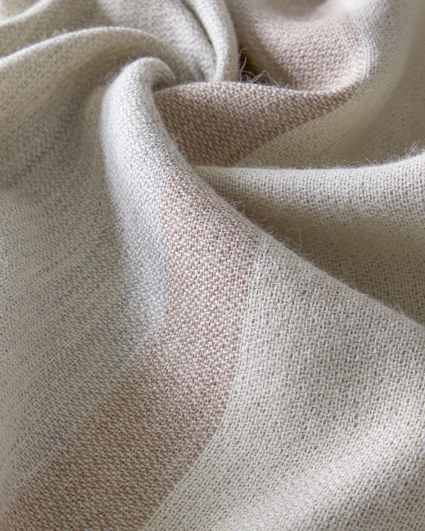 
                  
                    Detail of handmade Altura striped baby alpaca throw
                  
                