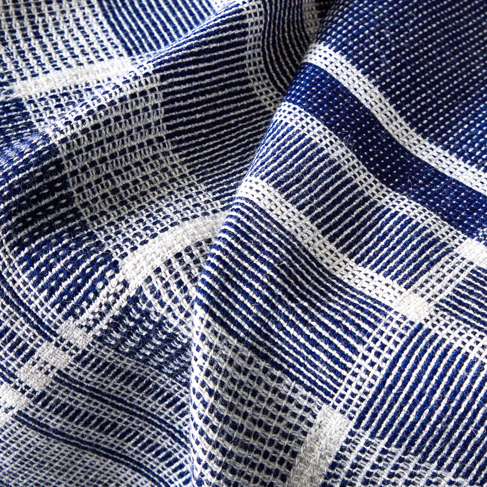 Detail of blue and white striped alpaca throw blanket. Handmade in Peru.