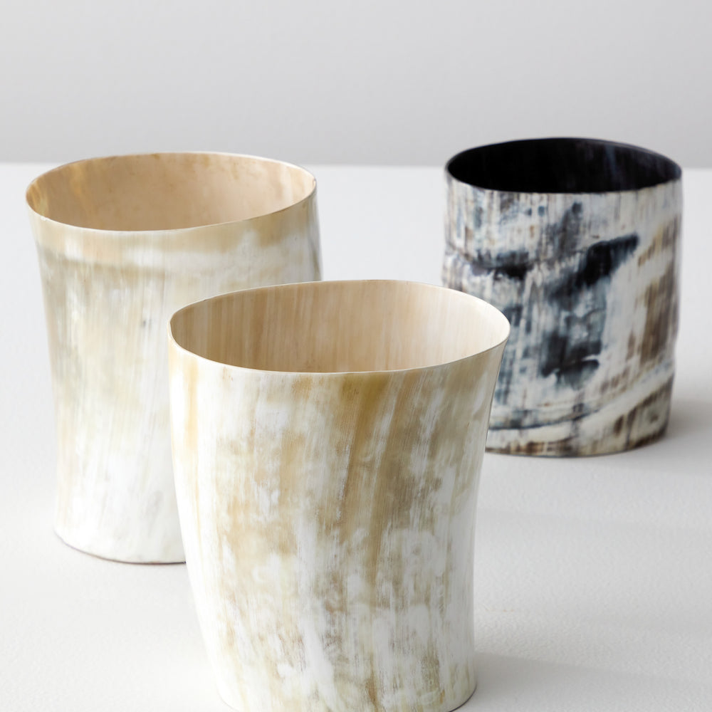 
                  
                    Light and dark Kibwe utensil holders each one of a kind made with ethically sourced Ankole horn.
                  
                