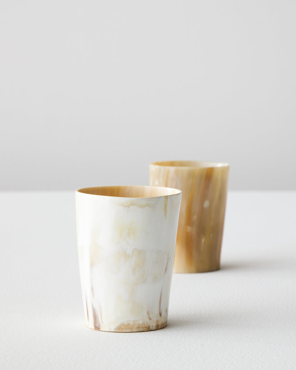 Luxury Fairkind tumblers and home shelf decor ethically sourced in Uganda. Handmade with unique recycled horn material.