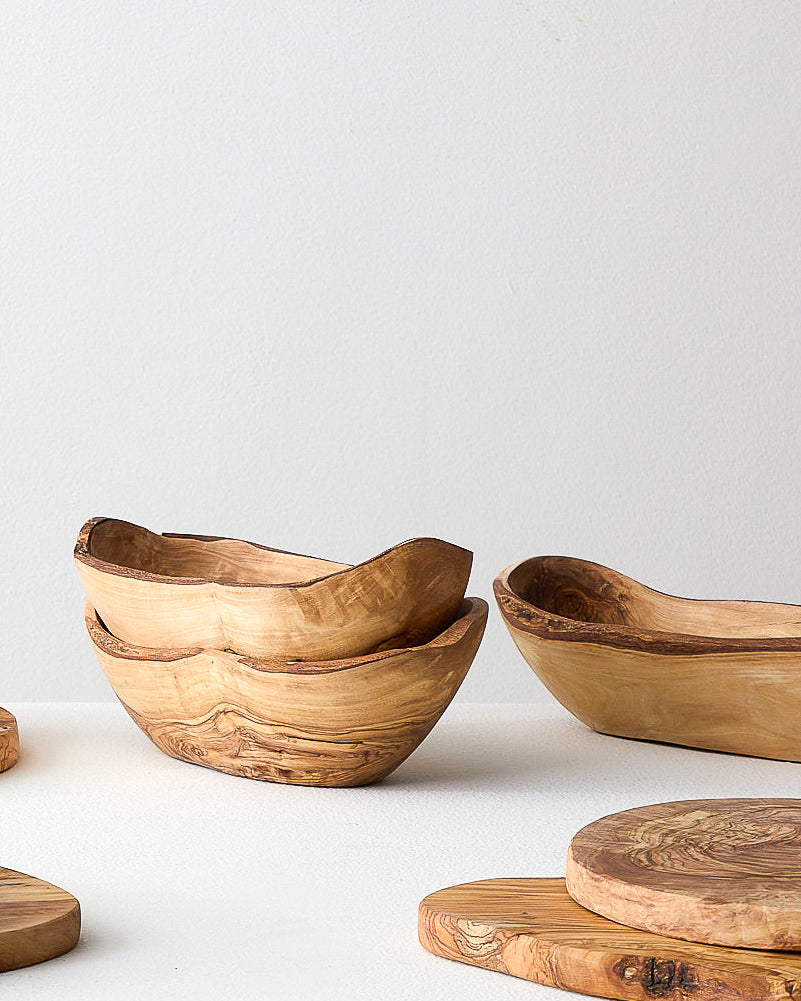 Collection of Medina Serving bowls and other olive wood servingware handcrafted in Tunisia.