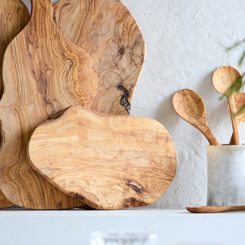 
                  
                    Holiday table with sideboard of olive wood serving boards. Handcrafted in Tunisia.
                  
                