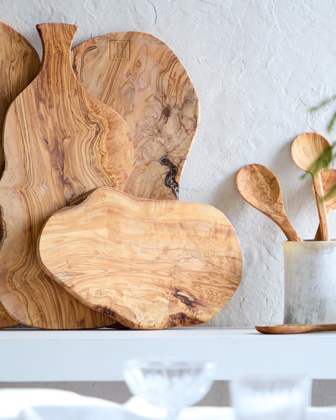 
                  
                    Holiday table with sideboard of olive wood serving boards. Handcrafted in Tunisia.
                  
                