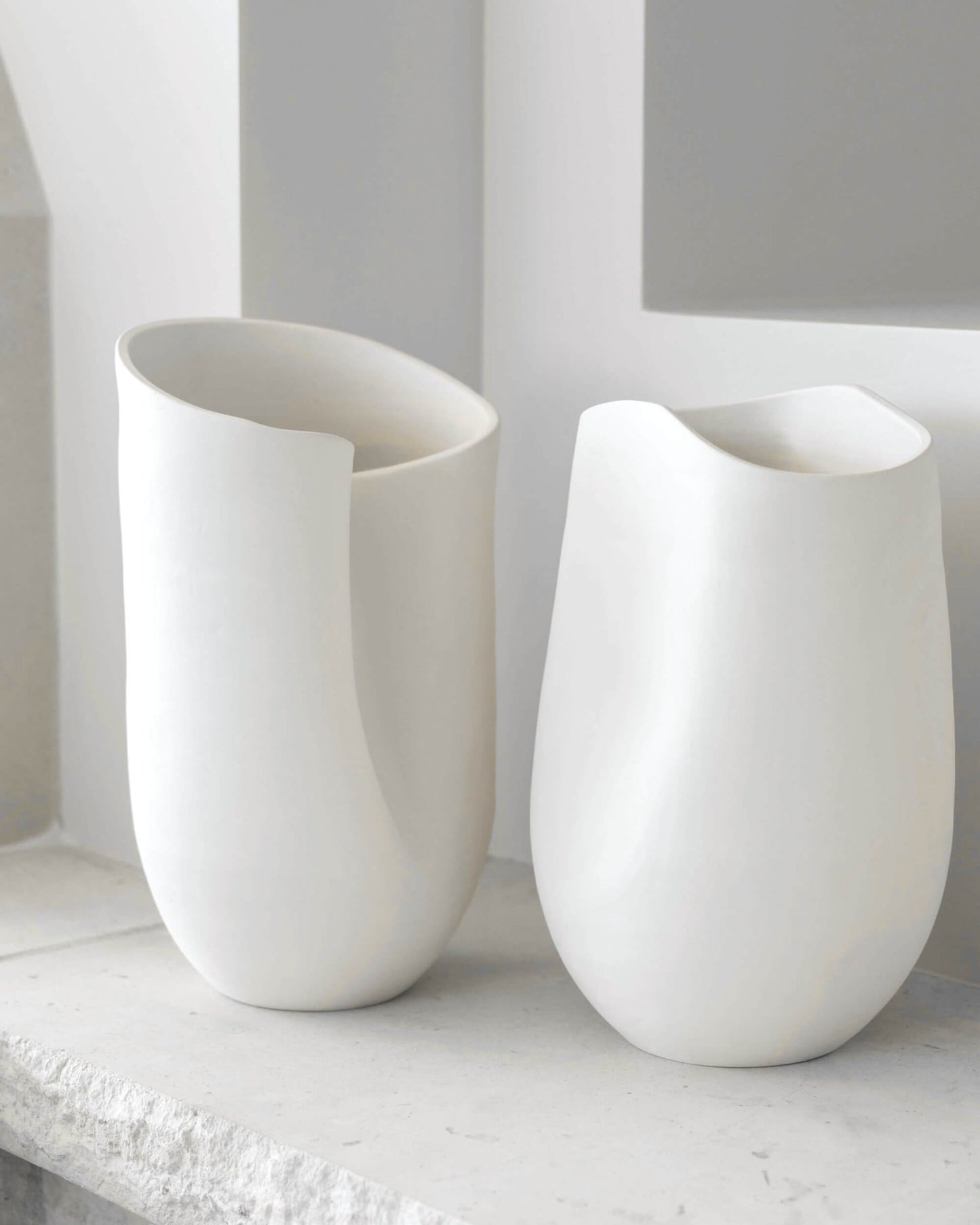 
                  
                    Large and Medium Zoya Terracotta Vases by Fairkind styled on stone mantle.
                  
                