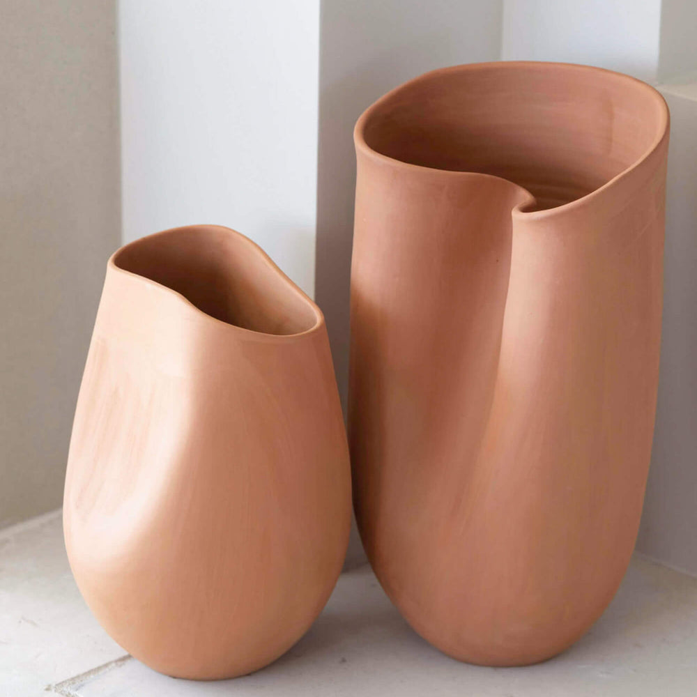 Large and small Tahj Terracotta Vases styled on stone mantle by Fairkind.