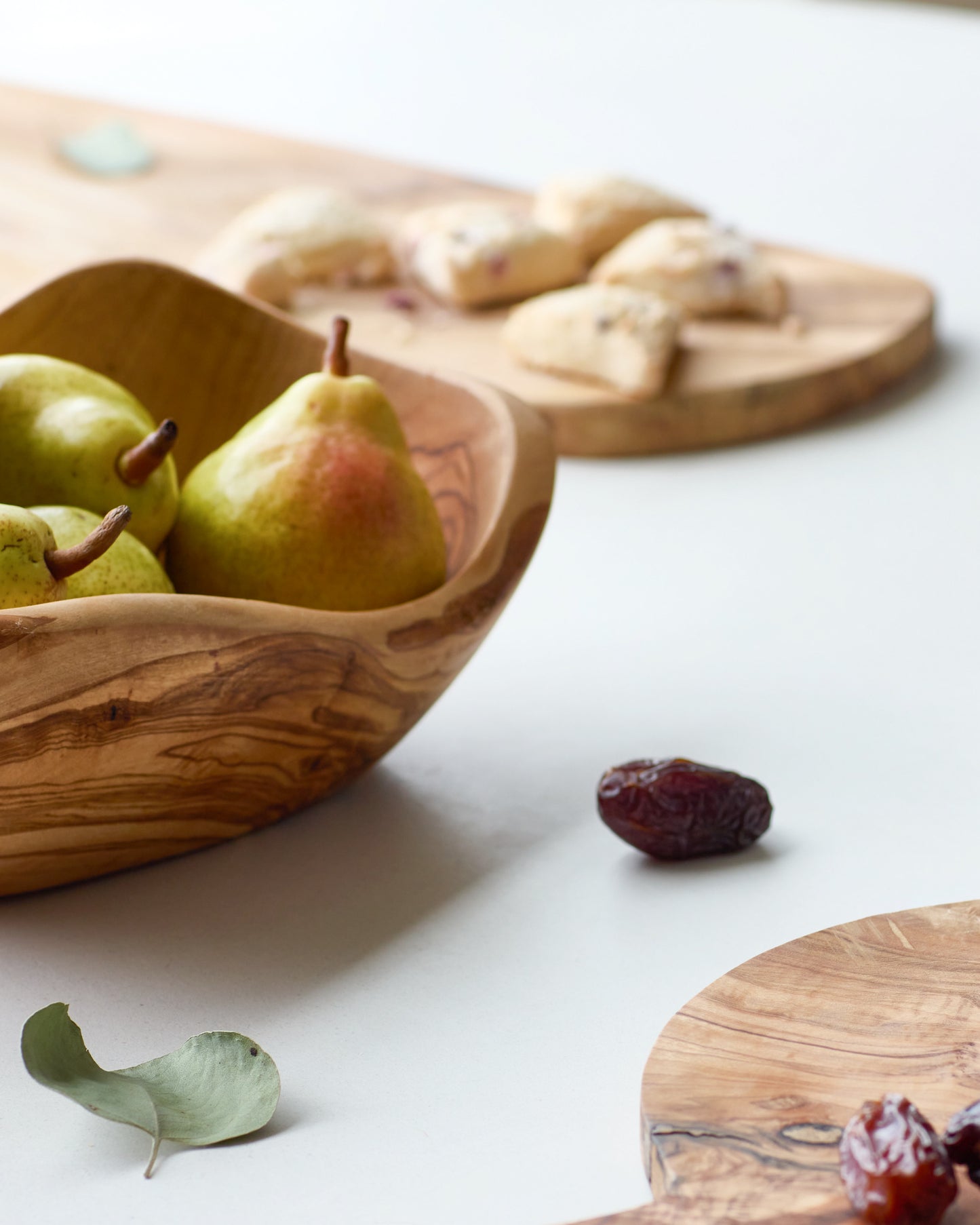 
                  
                    Holiday table spread with olive wood servingware made by master artisans in Tunisia.
                  
                