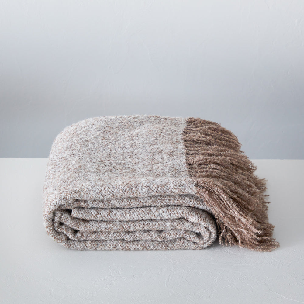 
                  
                    Chunky La Tierra alpaca throw blanket with fringe handwoven by master artisans in Peru.
                  
                