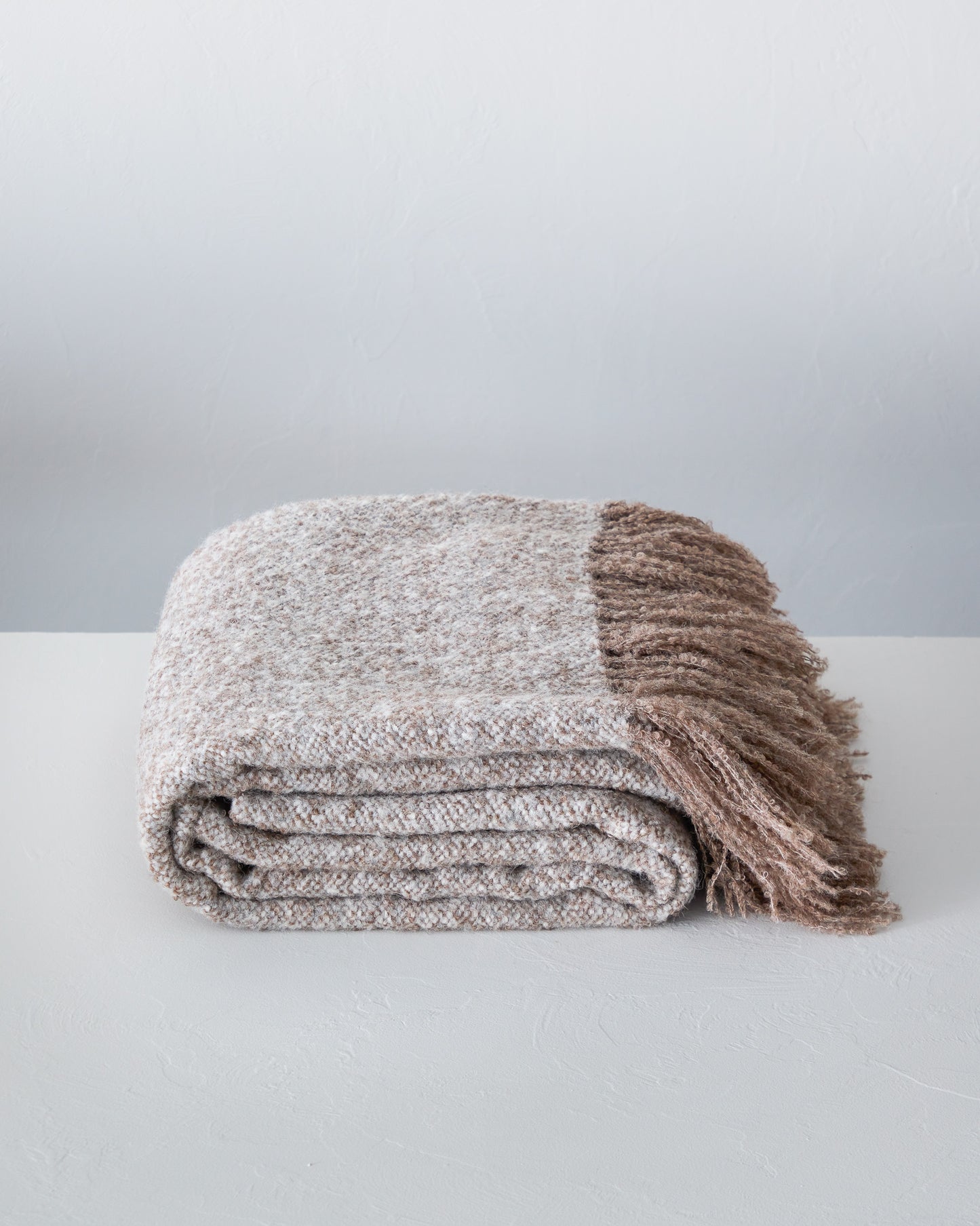 
                  
                    Chunky La Tierra alpaca throw blanket with fringe handwoven by master artisans in Peru.
                  
                