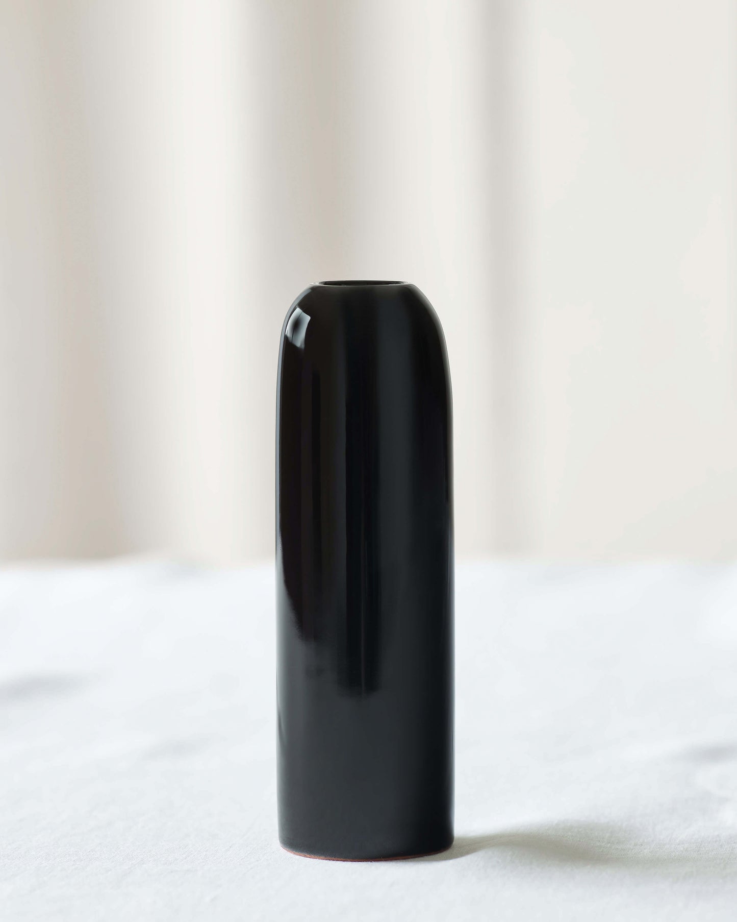 
                  
                    Black Yasmine Taper Holder by Fairkind. Handcrafted for Fairkind's Morocco Ceramic Collection.
                  
                