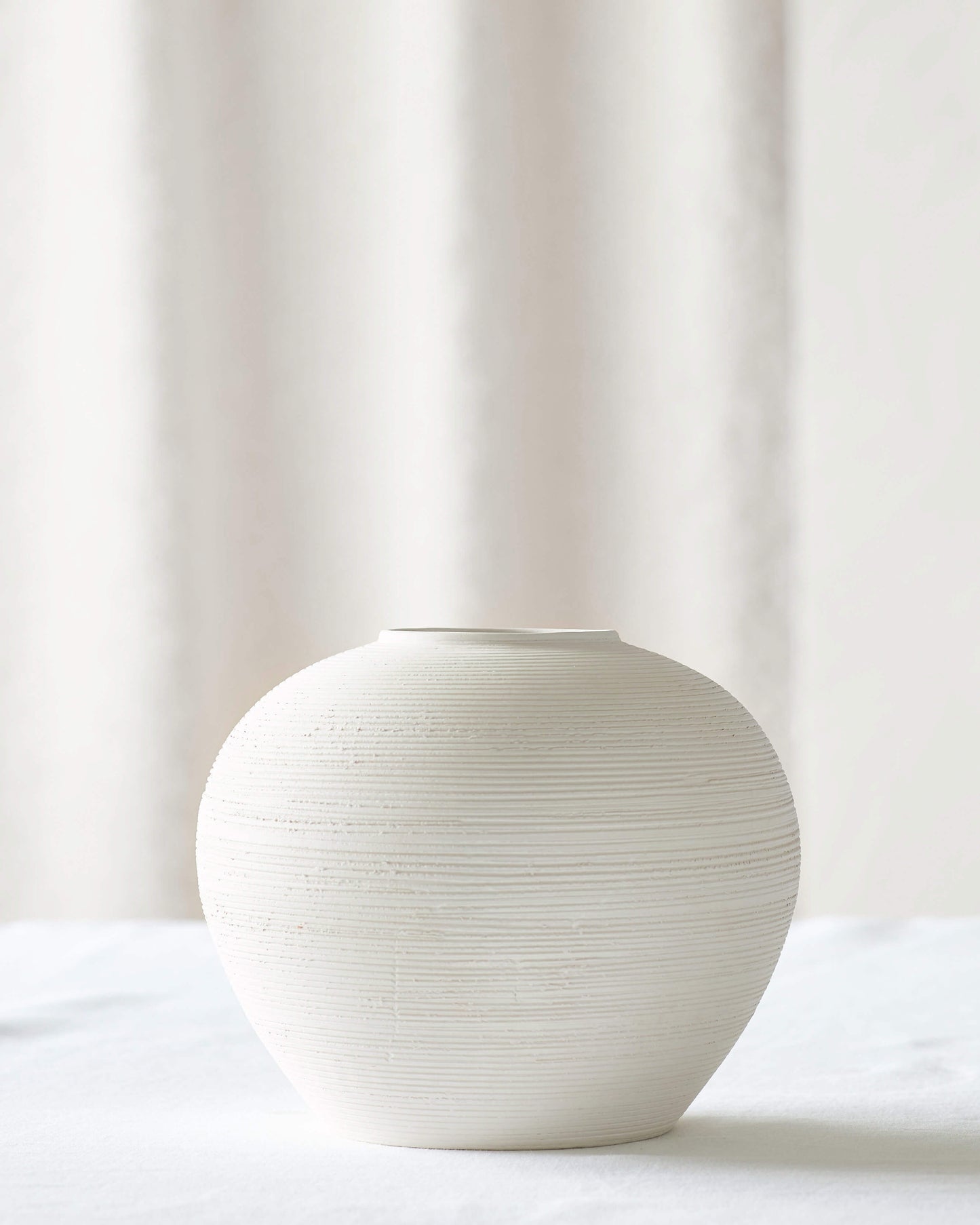 Small Zarina Vase by Fairkind. Handmade in Morocco with raw white bisque clay.