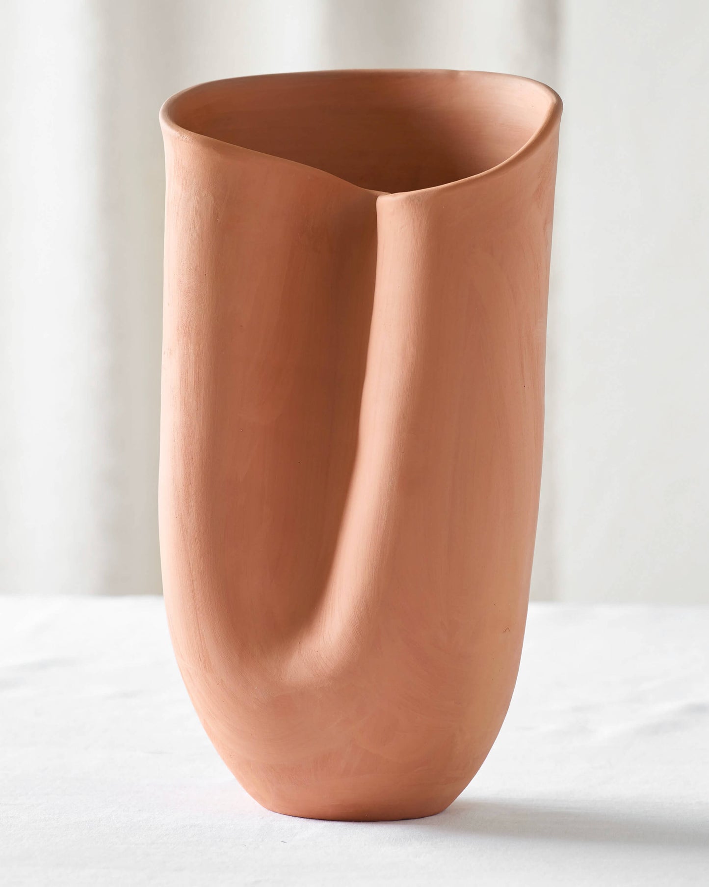 
                  
                    Large sculptural terracotta vase, one of three sizes of the Tahj Terracotta Vases by Fairkind.
                  
                