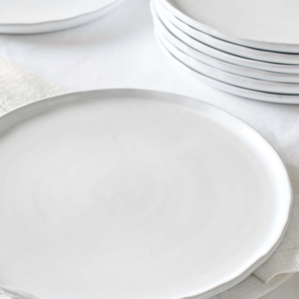 
                  
                    Khira ceramic dinner plates stacked against white background. Made by artisans in Morocco.
                  
                