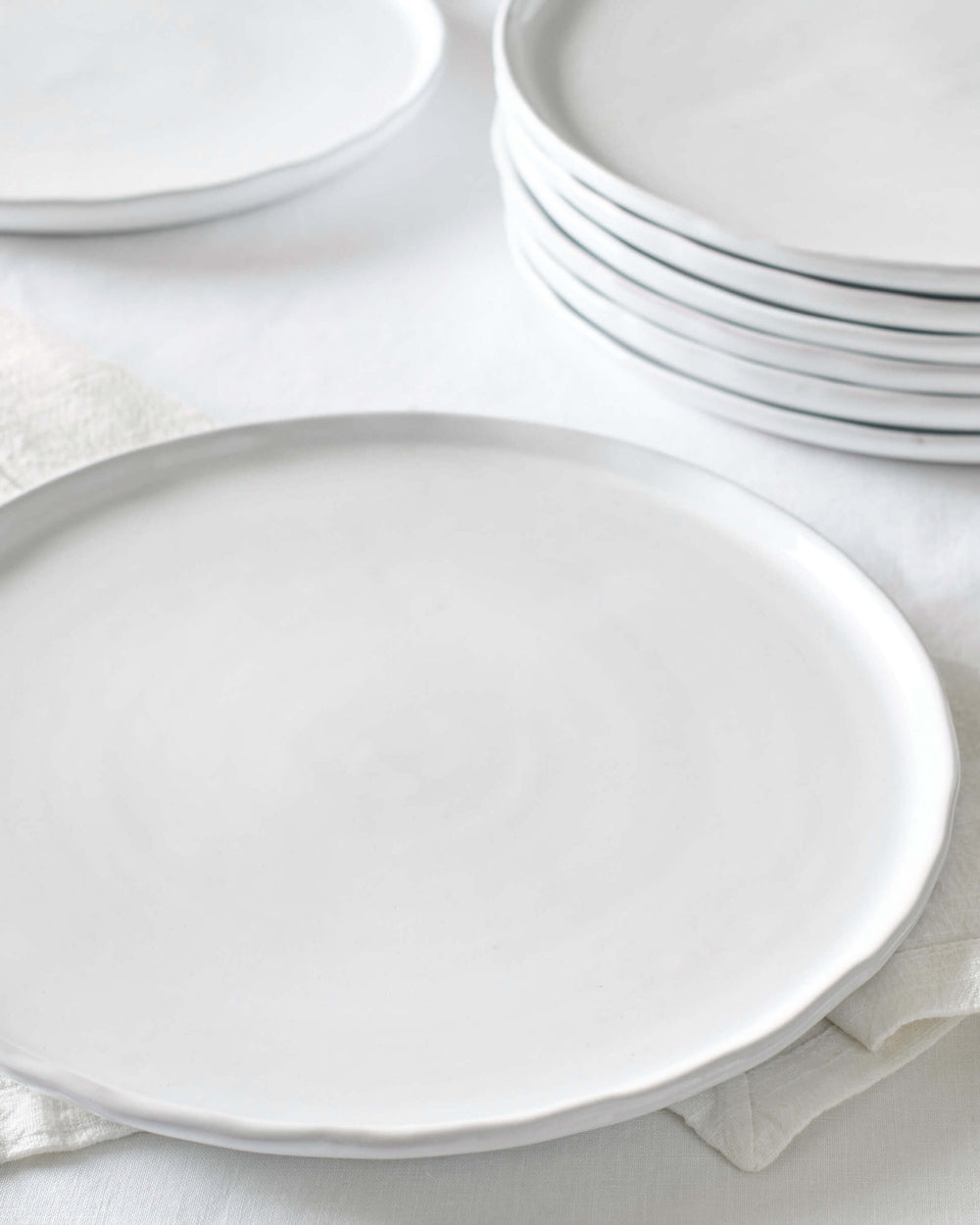 Khira ceramic dinner plates stacked against white background. Made by artisans in Morocco.