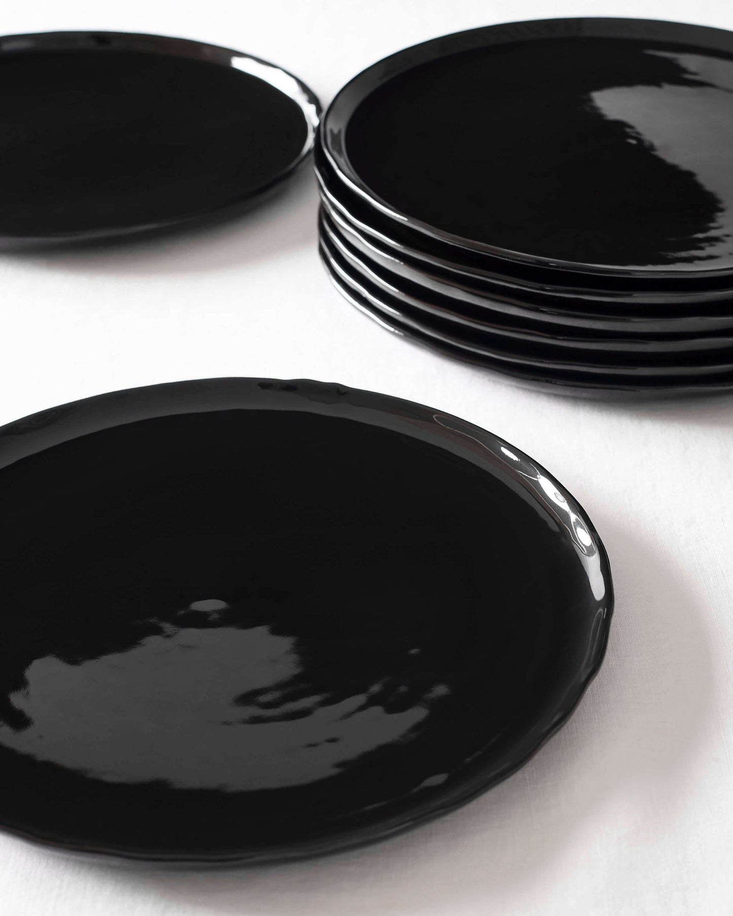 
                  
                    Modern, black Riad Dinner Plates by Fairkind. Handcrafted in Morocco and finished with a shiny glaze.
                  
                