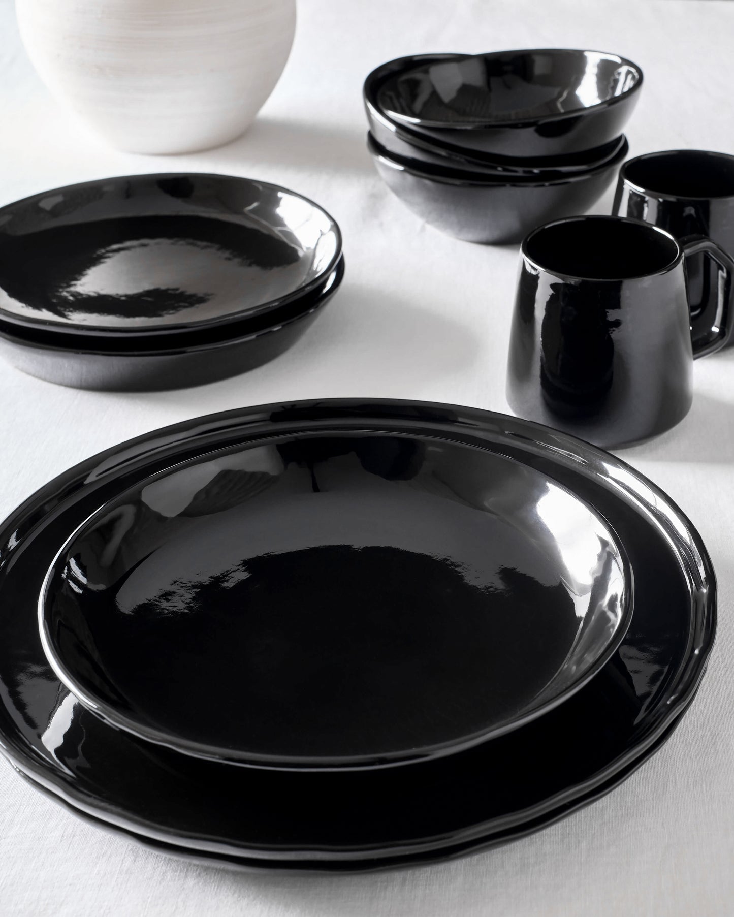 Riad Dinnerware by Fairkind styled on white table.