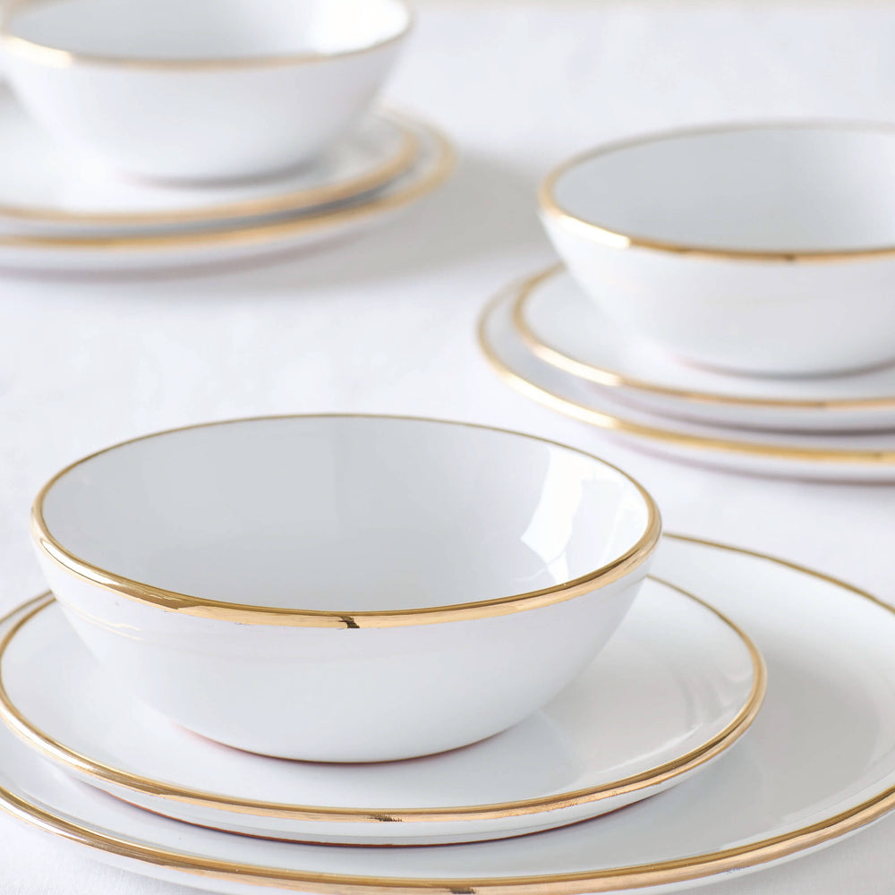 
                  
                    Fez Gold Rimmed Dinnerware sets by Fairkind. White ceramic tableware with 18k gold edge.
                  
                