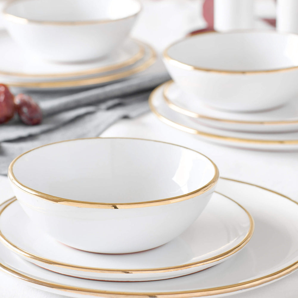 
                  
                    Fez Gold-Rimmed Dinnerware by Fairkind styled on a modern, minimal table.
                  
                