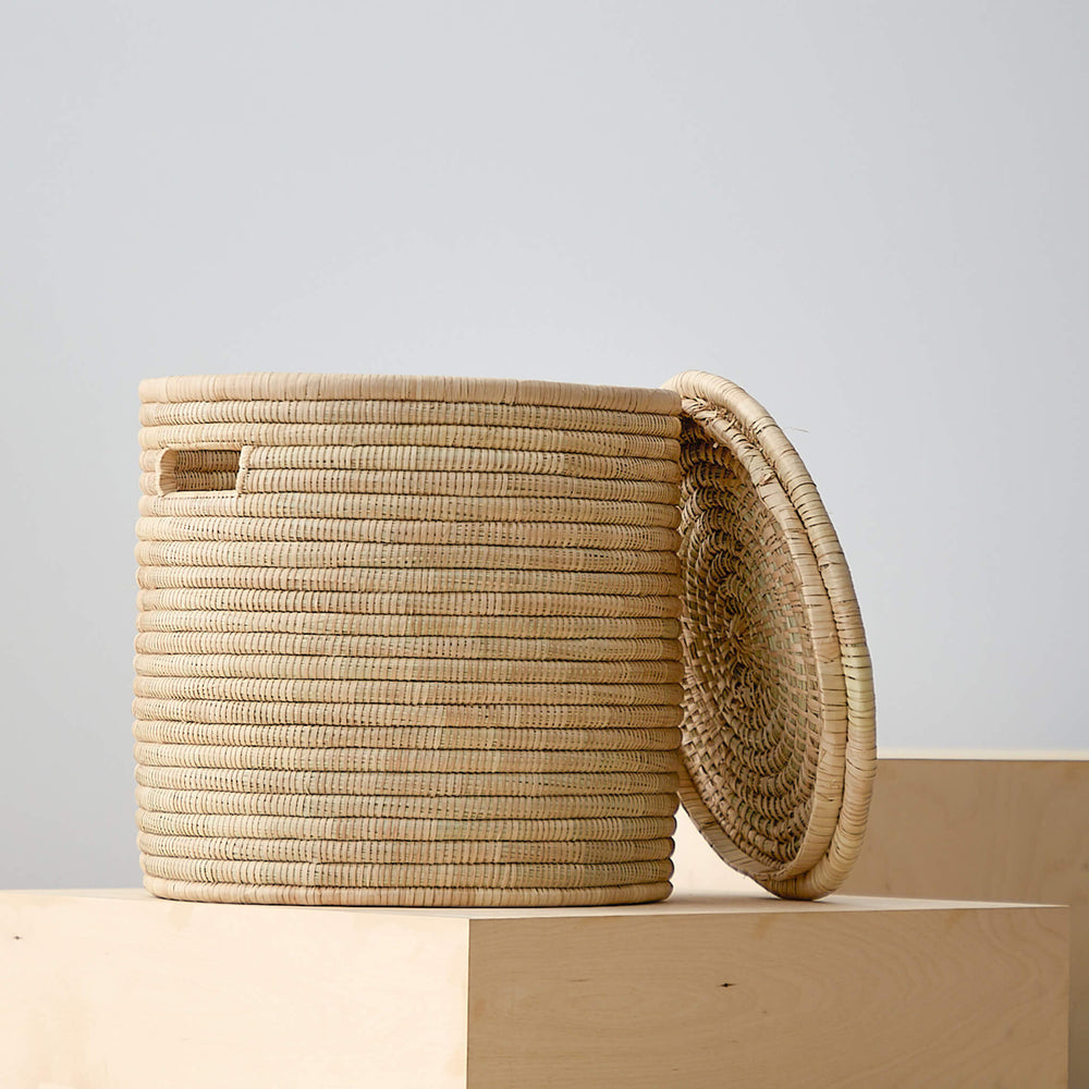 
                  
                    Small lidded Salima storage basket by Fairkind.
                  
                